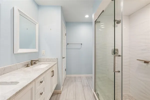 a bathroom with a sink a vanity and a mirror
