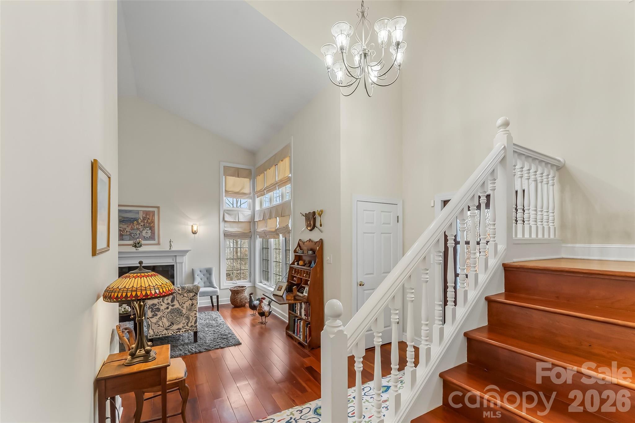 1726 Waterford Way Morganton, NC 28655 - Photo 20 of 45 a view of a livingroom with furniture staircase wooden floor and chandelier