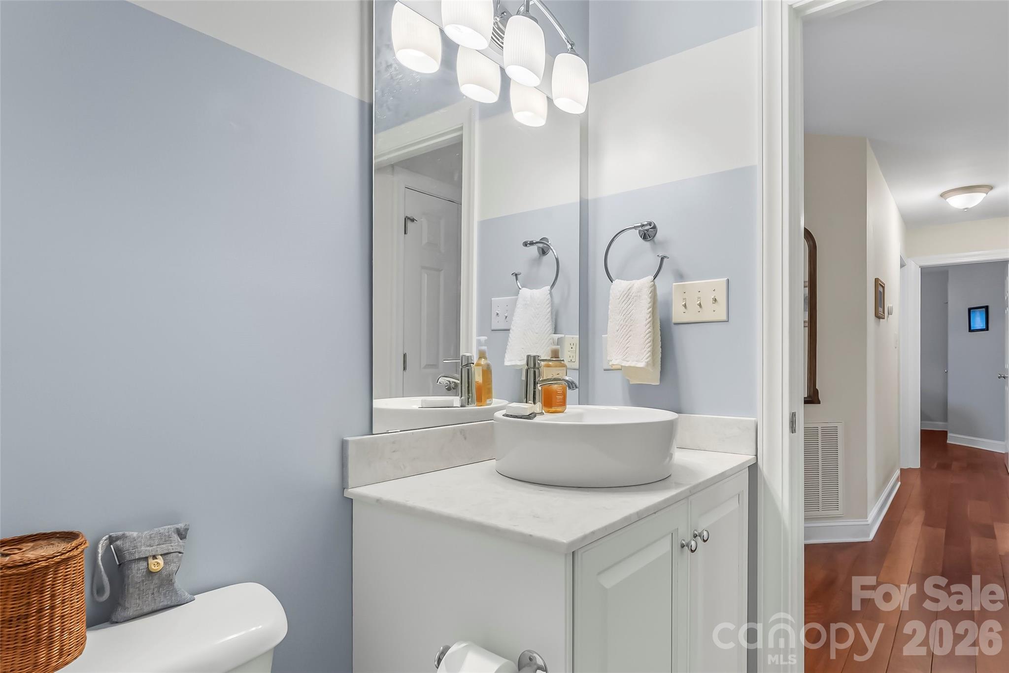 1726 Waterford Way Morganton, NC 28655 - Photo 22 of 45 a bathroom with a sink a toilet and a mirror
