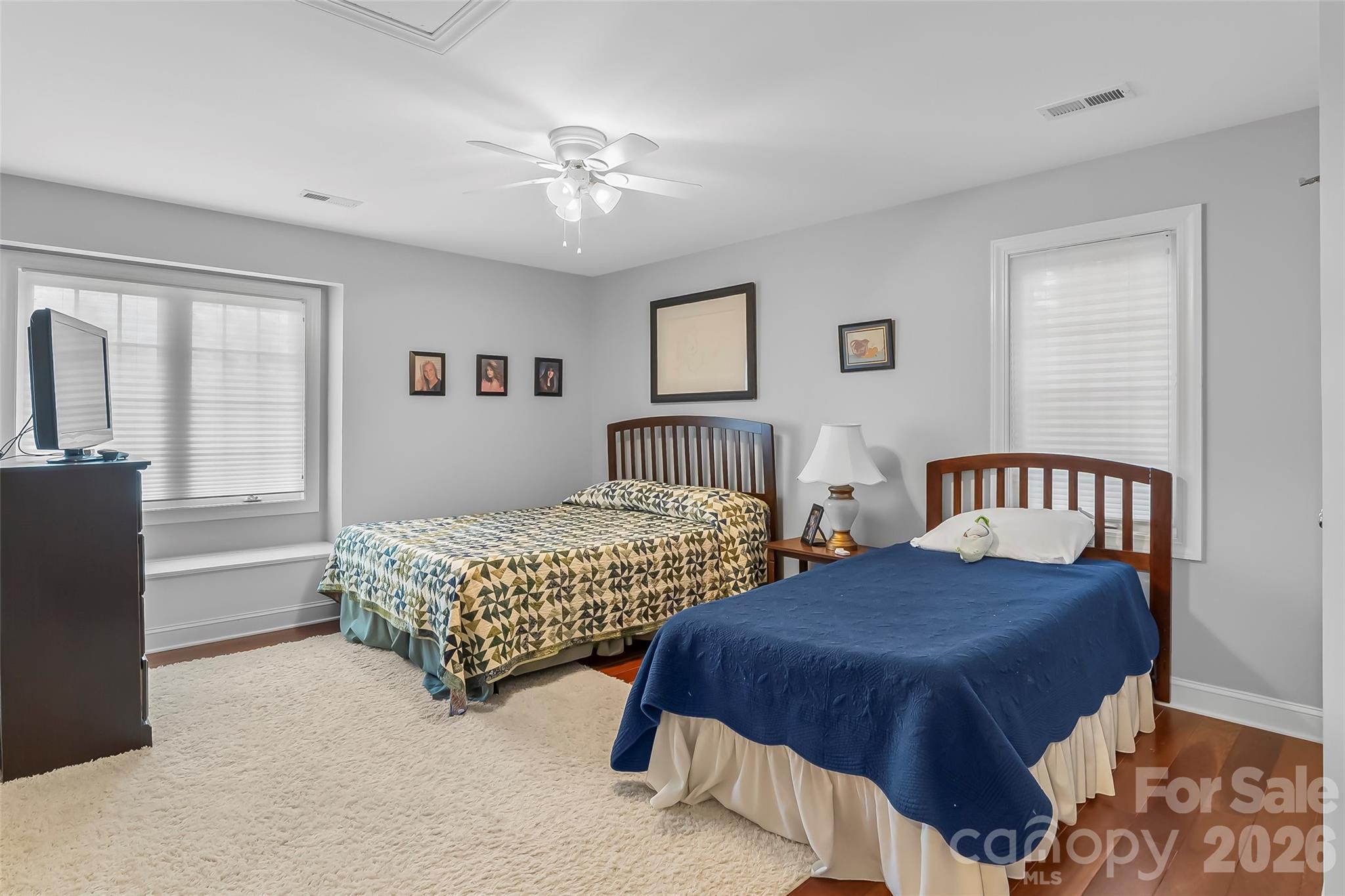 1726 Waterford Way Morganton, NC 28655 - Photo 28 of 45 a bedroom with two beds and a chandelier