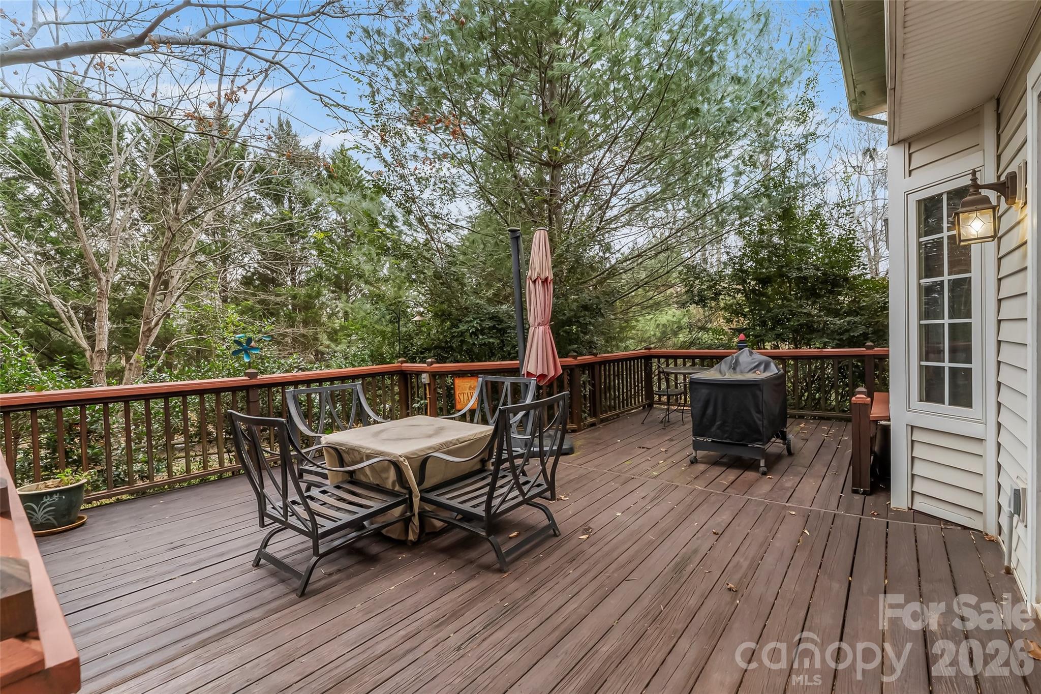 1726 Waterford Way Morganton, NC 28655 - Photo 31 of 45 a view of a deck with two chairs and wooden floor
