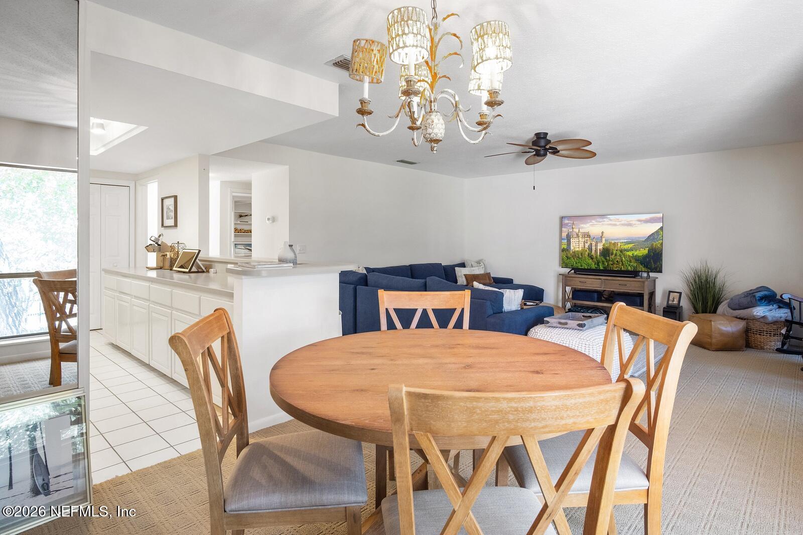 8012 Hollyridge Road, Unit 17U Jacksonville, FL 32256 - Photo 9 of 22 a view of a dining room with furniture