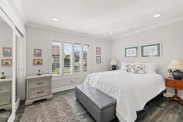 a bed room with a bed and a window