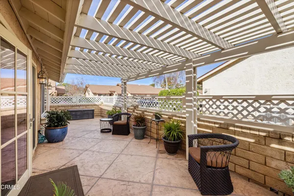 a view of a chairs and table in patio