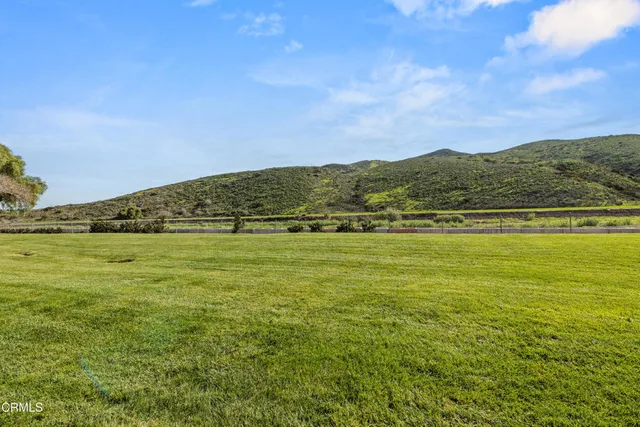 a view of an ocean from a mountain