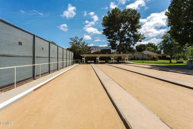 a view of a house with swimming pool and sitting area