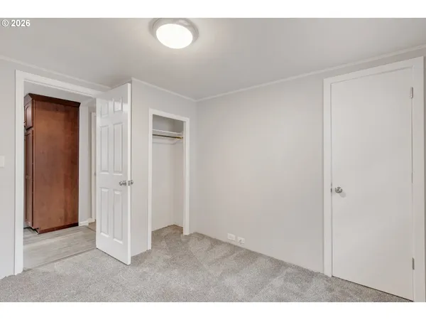 a big room with closet and mirror