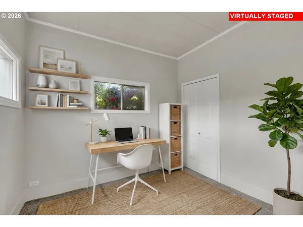 a workspace with furniture and a potted plant