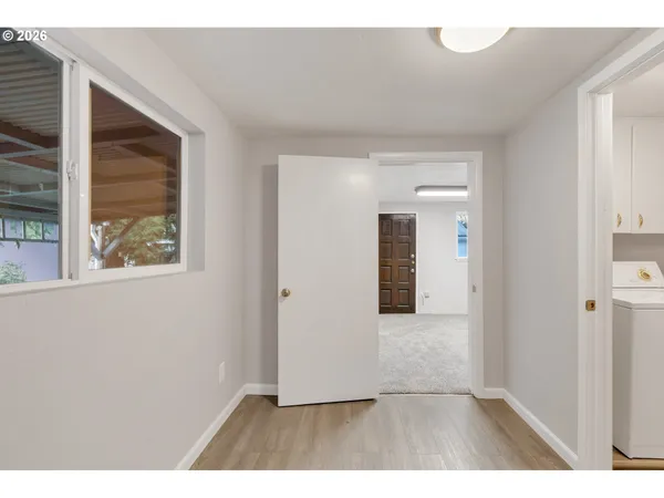 a view interior of a house and an entryway with wooden floor