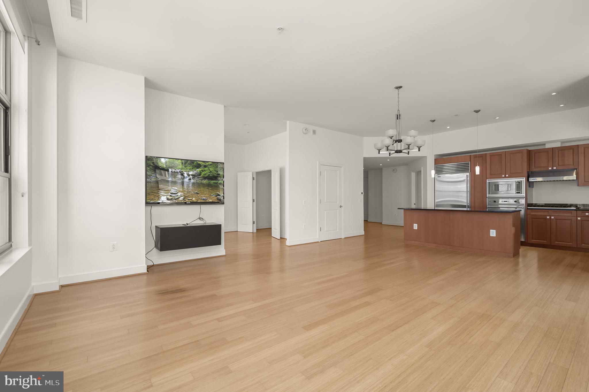 2425 L Street Northwest, Unit 617 Washington, DC 20037 - Photo 15 of 36 a view of a kitchen with a sink and a large window