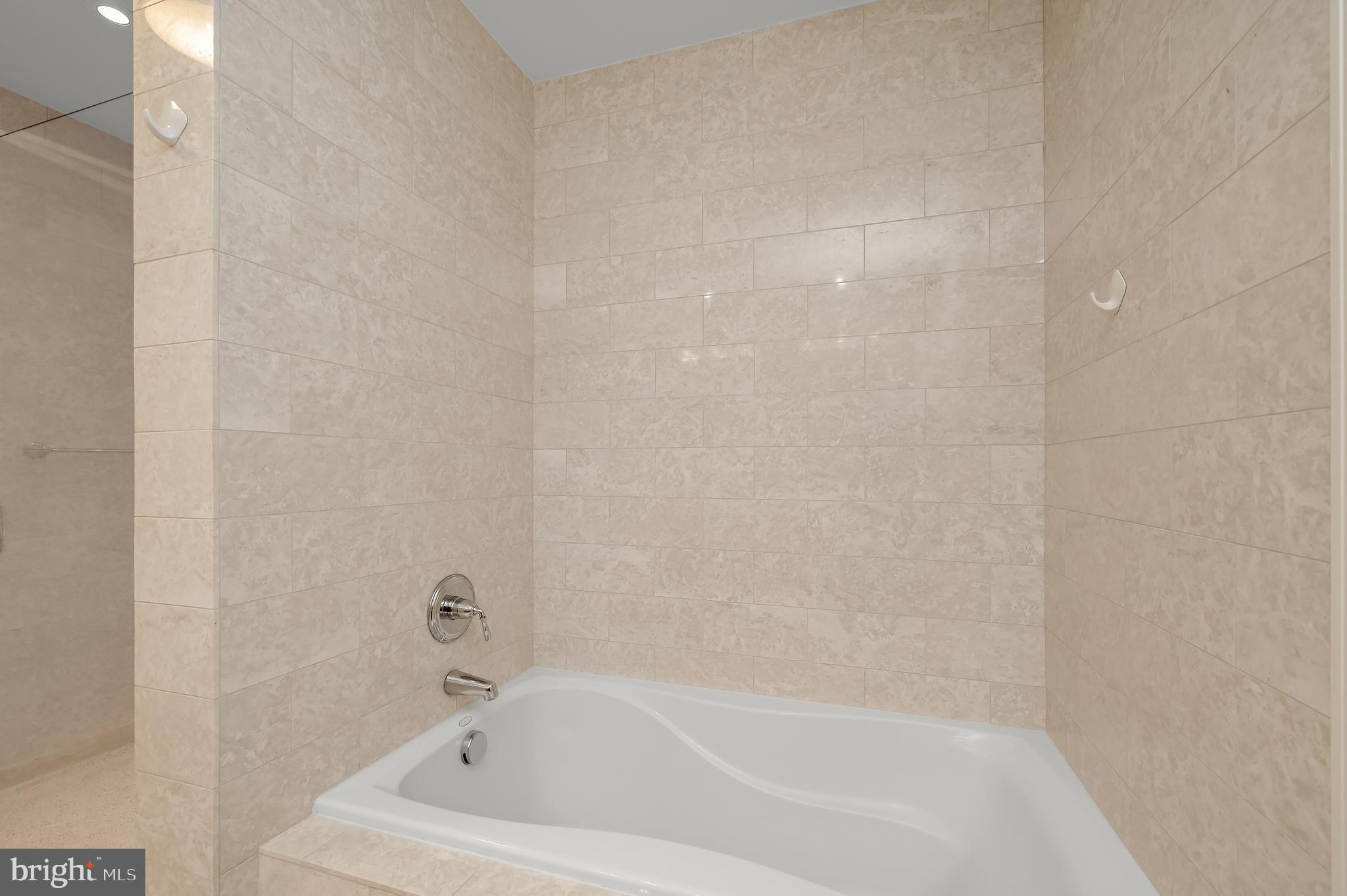 2425 L Street Northwest, Unit 617 Washington, DC 20037 - Photo 22 of 36 a bathroom with a bathtub