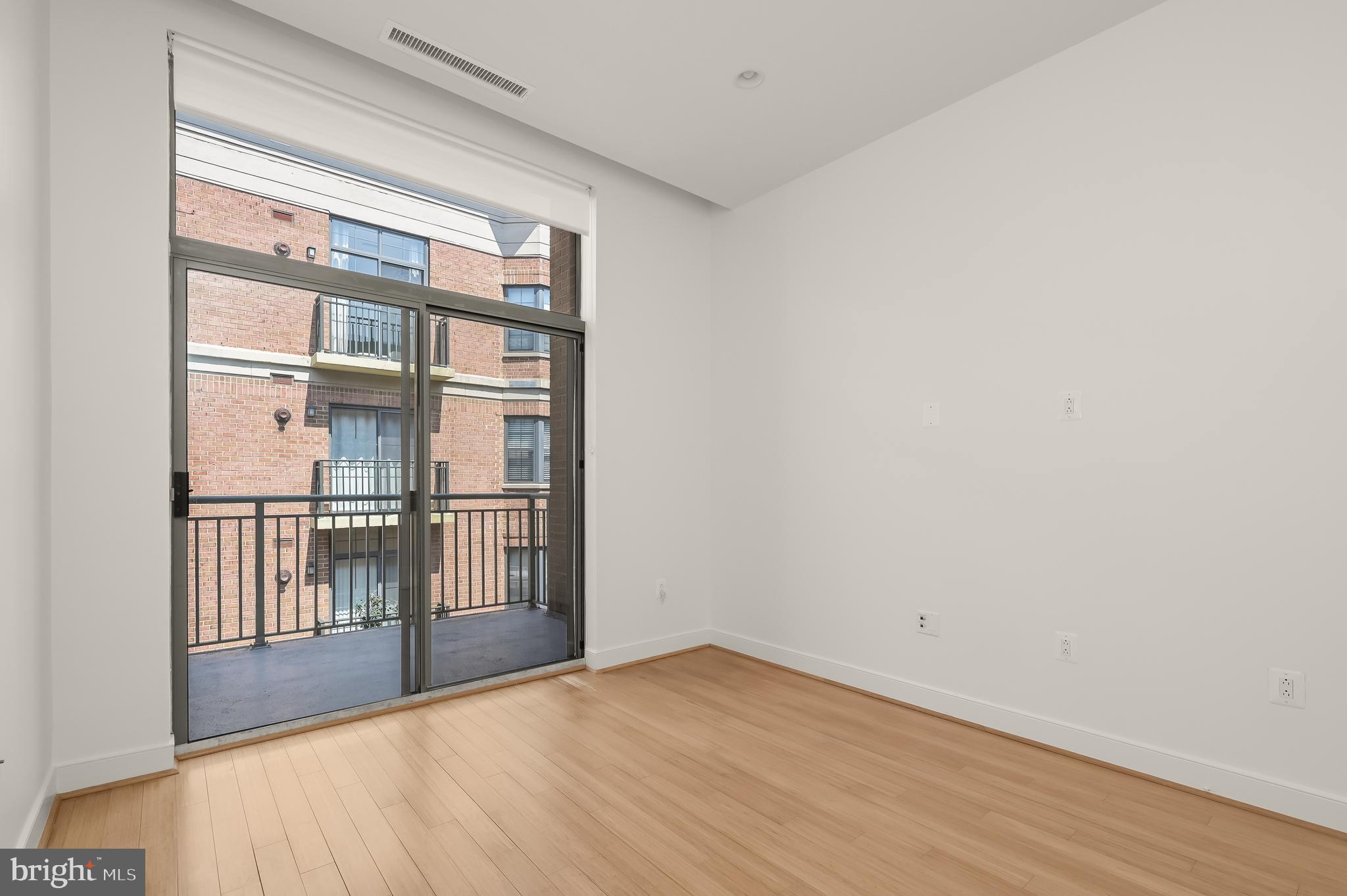 2425 L Street Northwest, Unit 617 Washington, DC 20037 - Photo 26 of 36 a view of an empty room with a window