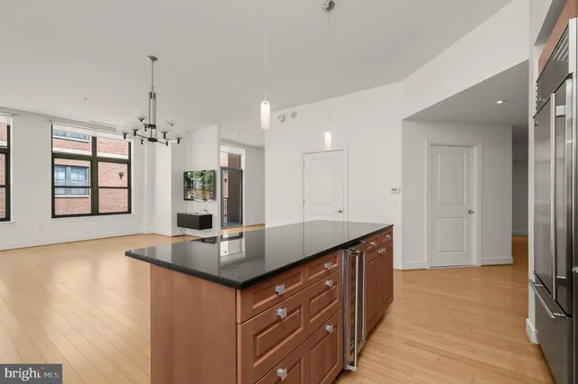 a kitchen with stainless steel appliances granite countertop a sink and a granite counter tops