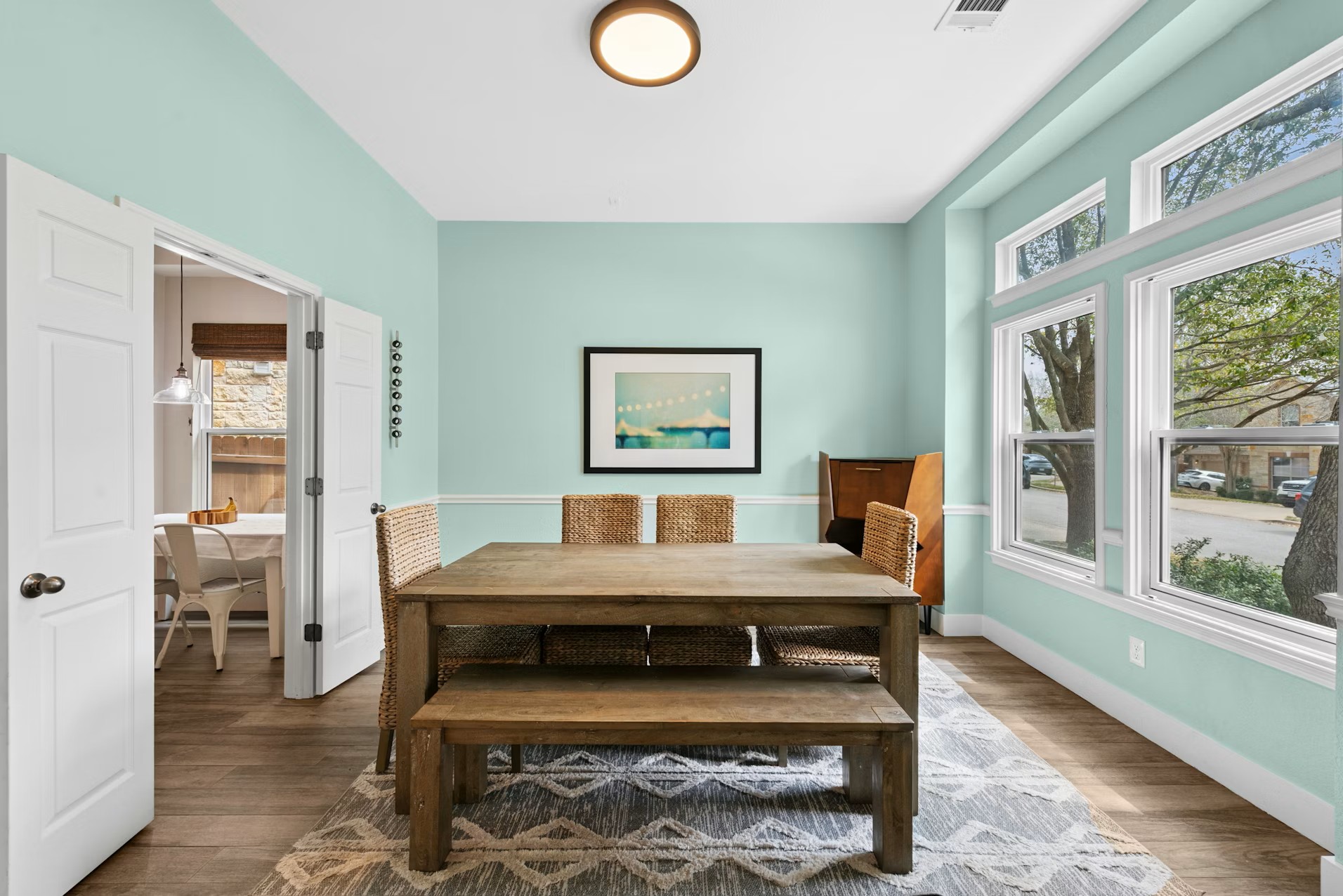 320 El Socorro Lane Austin, TX 78732 - Photo 11 of 40 a view of a dining room with furniture window and wooden floor