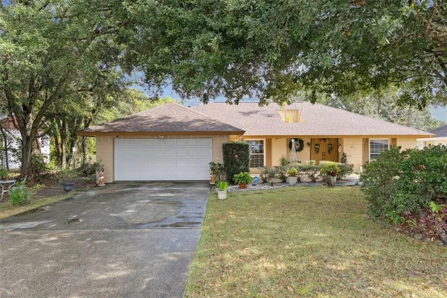 a front view of a house with yard porch and outdoor seating