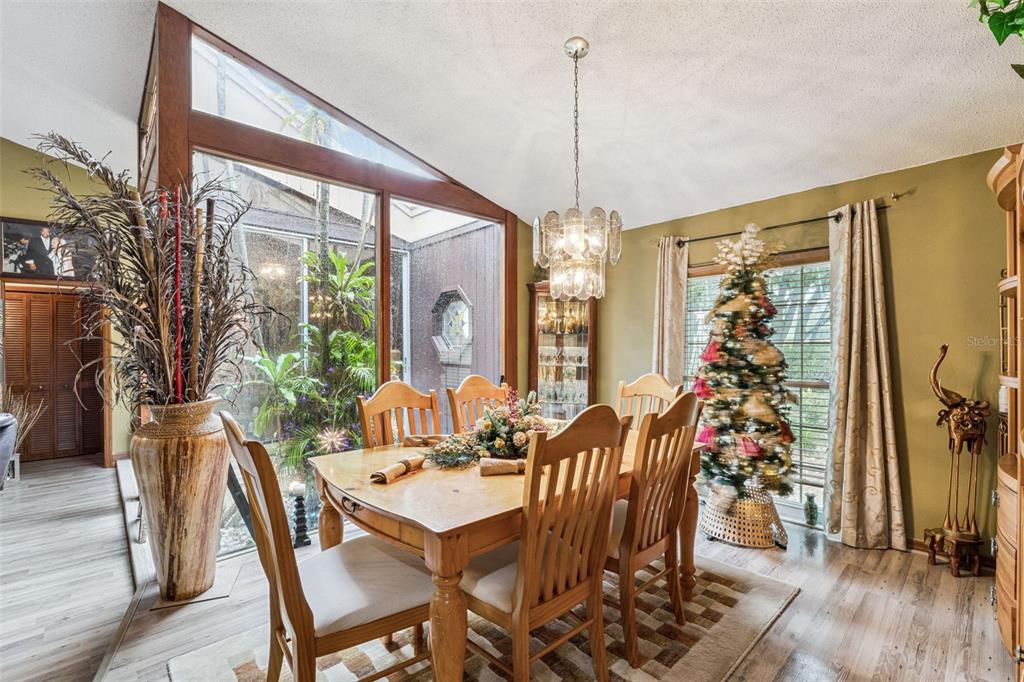611 North Forsyth Road Orlando, FL 32807 - Photo 24 of 36 a view of a dining room with furniture window and wooden floor