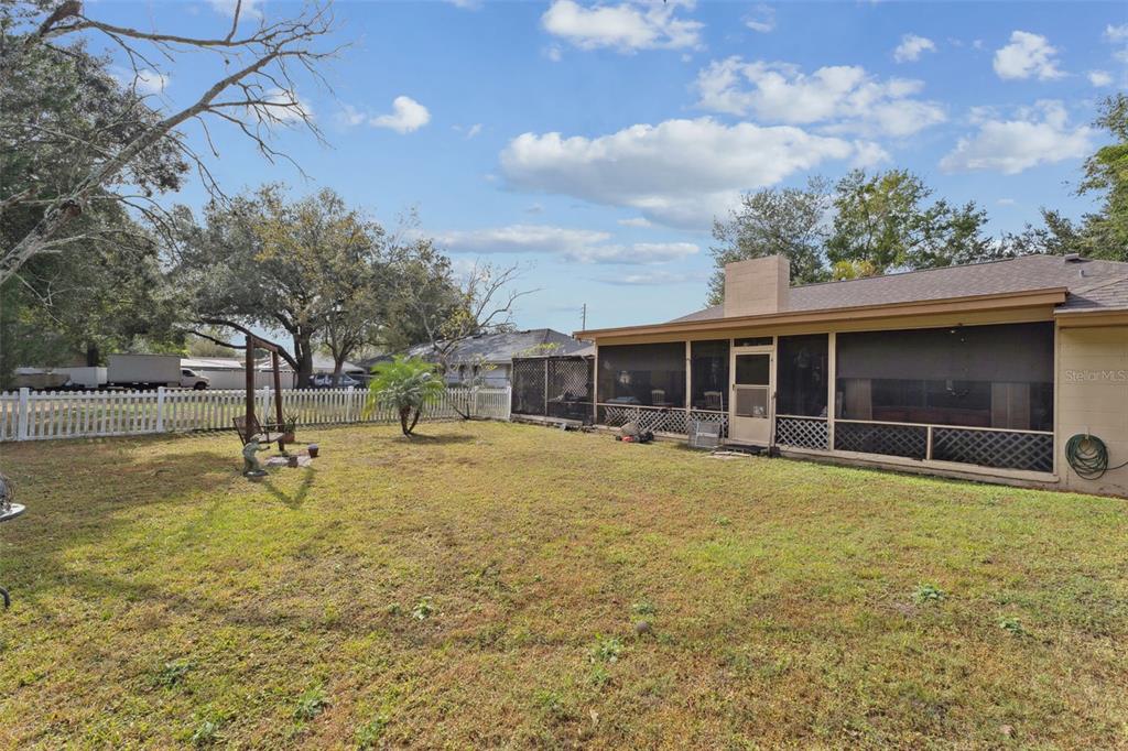 611 North Forsyth Road Orlando, FL 32807 - Photo 29 of 36 a swimming pool with outdoor seating and yard