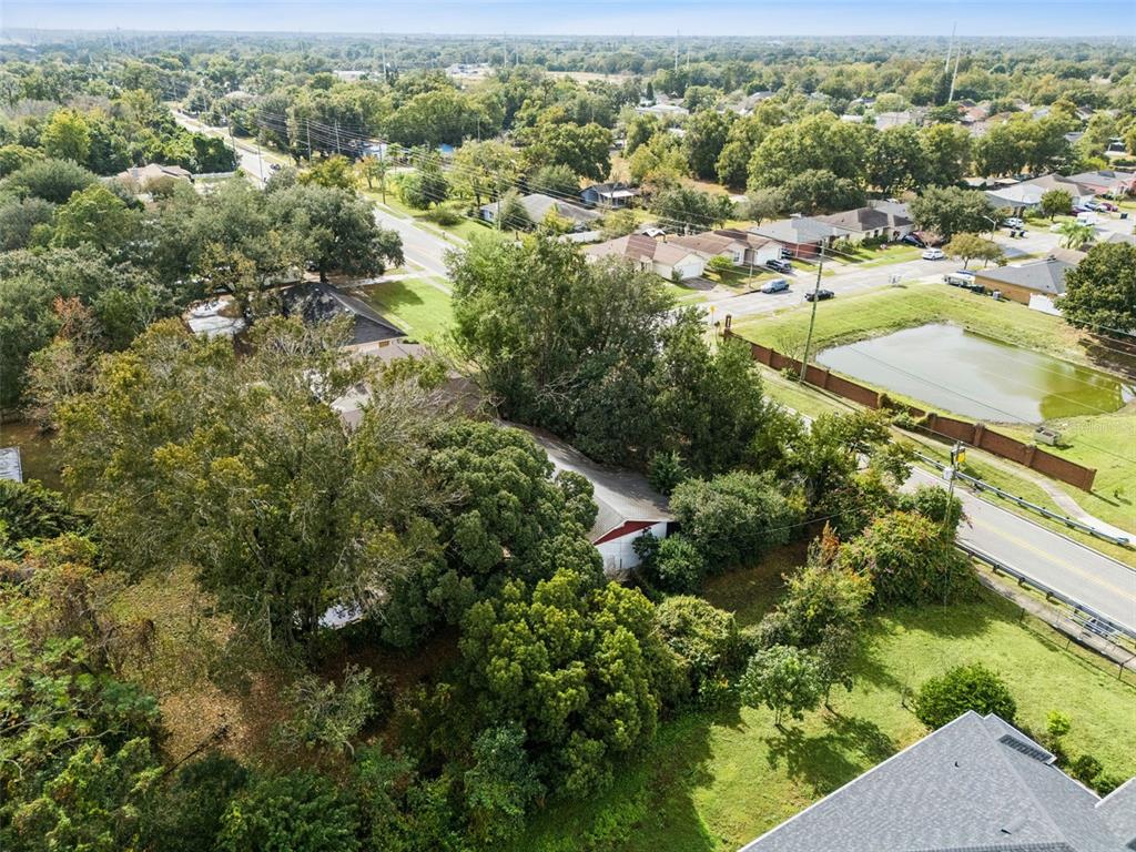 611 North Forsyth Road Orlando, FL 32807 - Photo 31 of 36 an aerial view of residential houses with outdoor space and trees