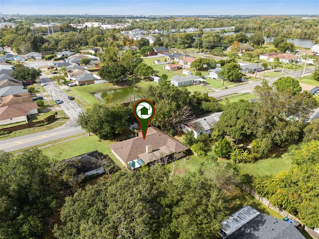 611 North Forsyth Road Orlando, FL 32807 - Photo 34 of 36 an aerial view of a house with a yard