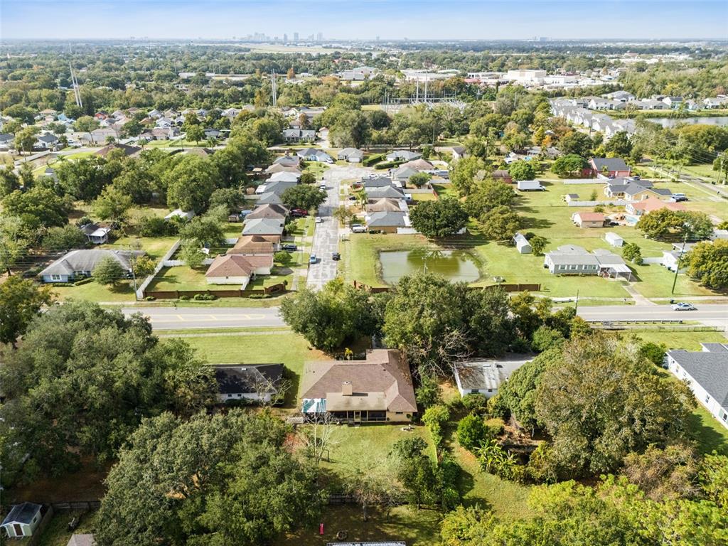 611 North Forsyth Road Orlando, FL 32807 - Photo 35 of 36 an aerial view of residential houses with outdoor space and trees