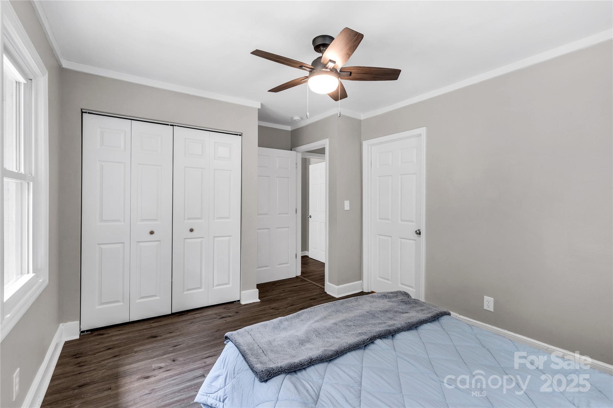 1641 Converse Street Lancaster, SC 29720 - Photo 18 of 33 a bedroom with a large bed and a chandelier fan