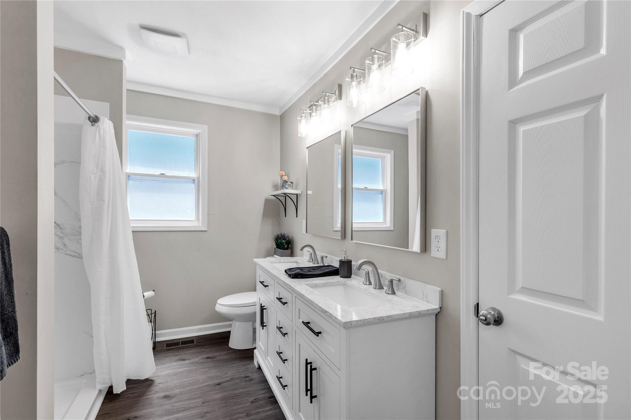 1641 Converse Street Lancaster, SC 29720 - Photo 19 of 33 a bathroom with a granite countertop sink mirror and a toilet