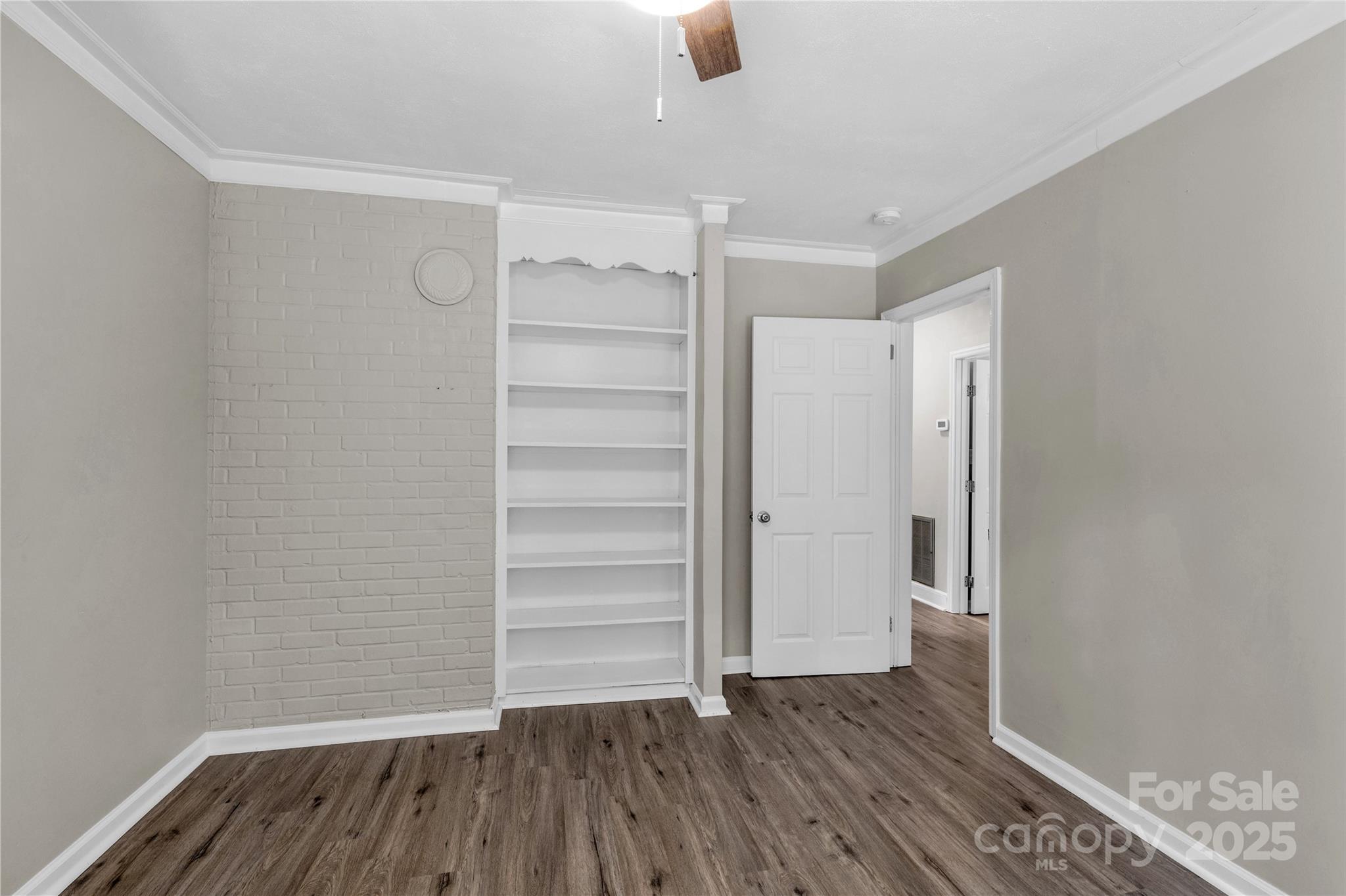 1641 Converse Street Lancaster, SC 29720 - Photo 22 of 33 a view of walk in closet with empty racks