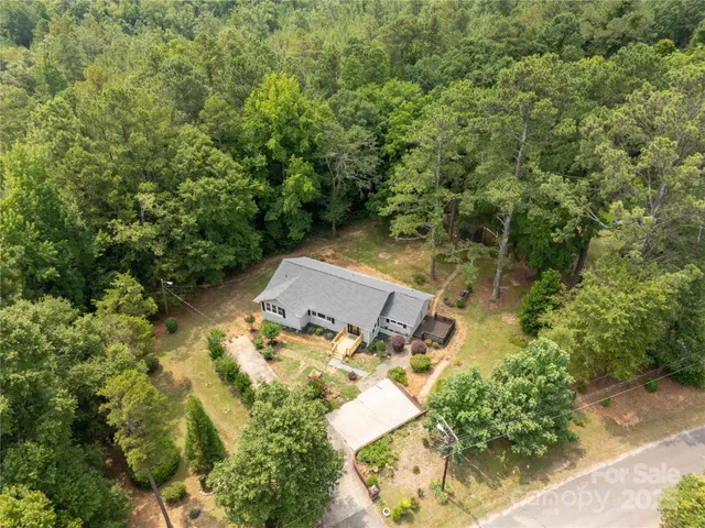 an aerial view of residential house with outdoor space