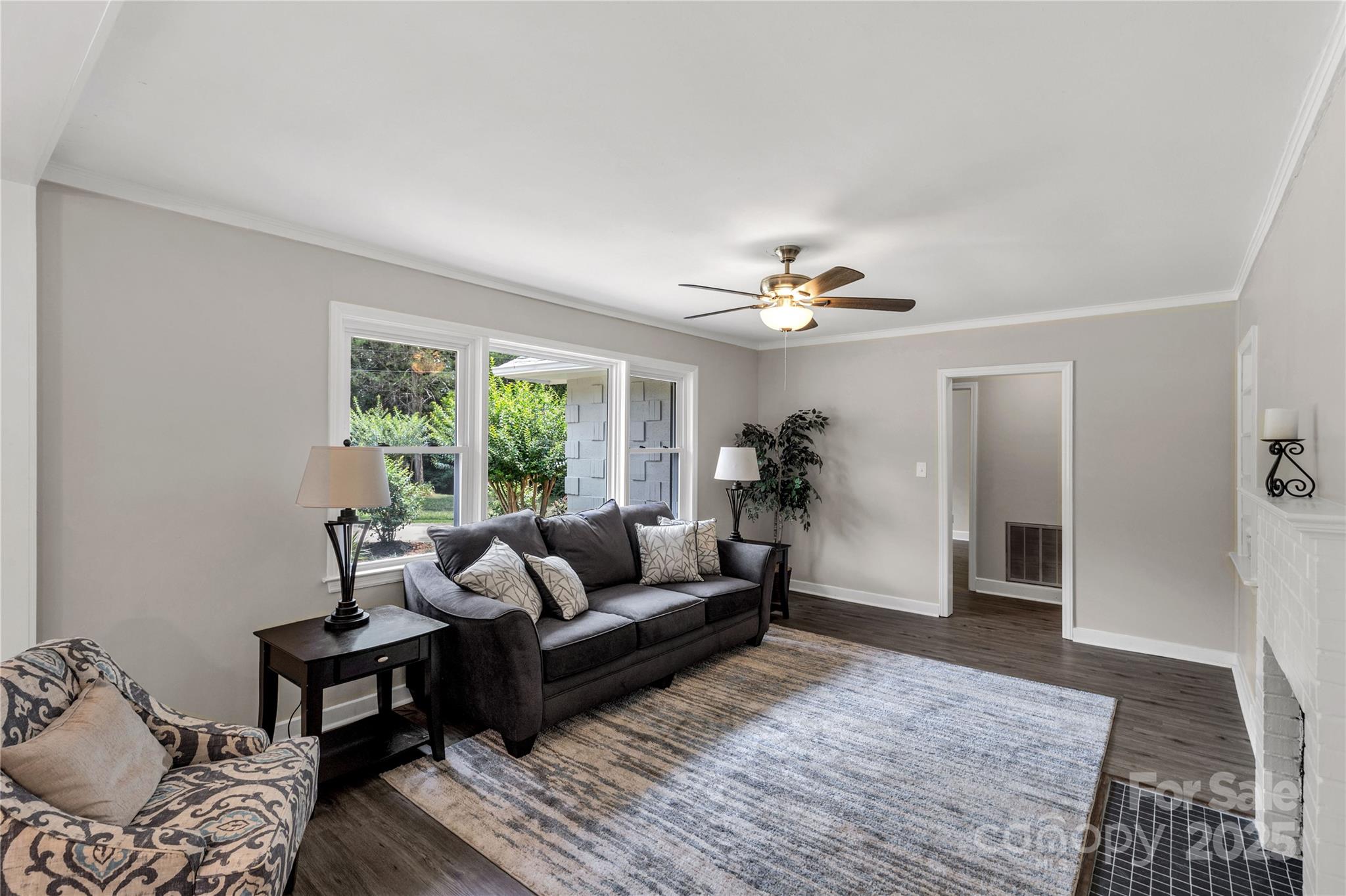 1641 Converse Street Lancaster, SC 29720 - Photo 5 of 33 a living room with furniture and a chandelier