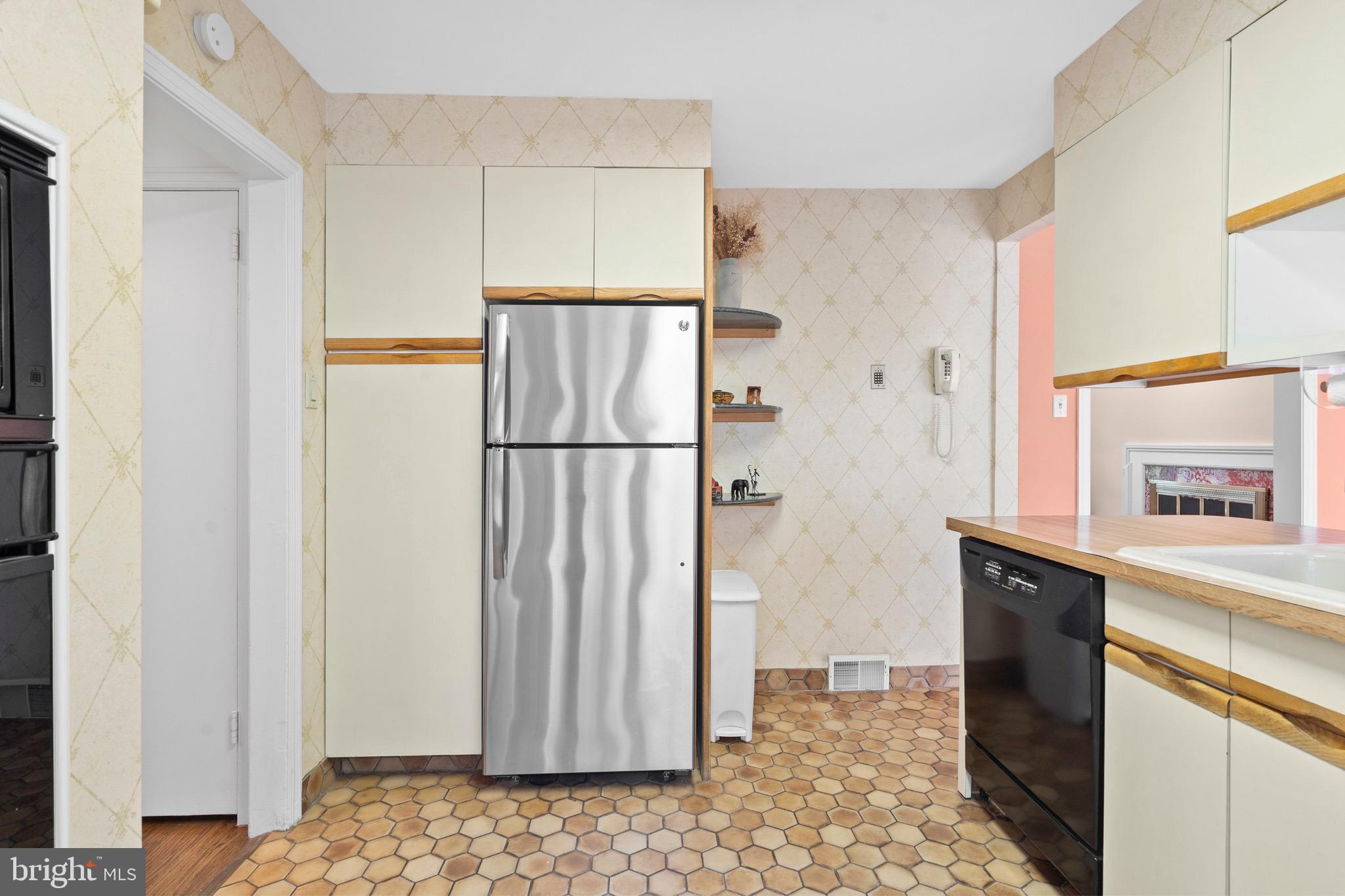 610 Broad Acres Road Penn Valley, PA 19072 - Photo 14 of 41 a kitchen with a refrigerator and a sink