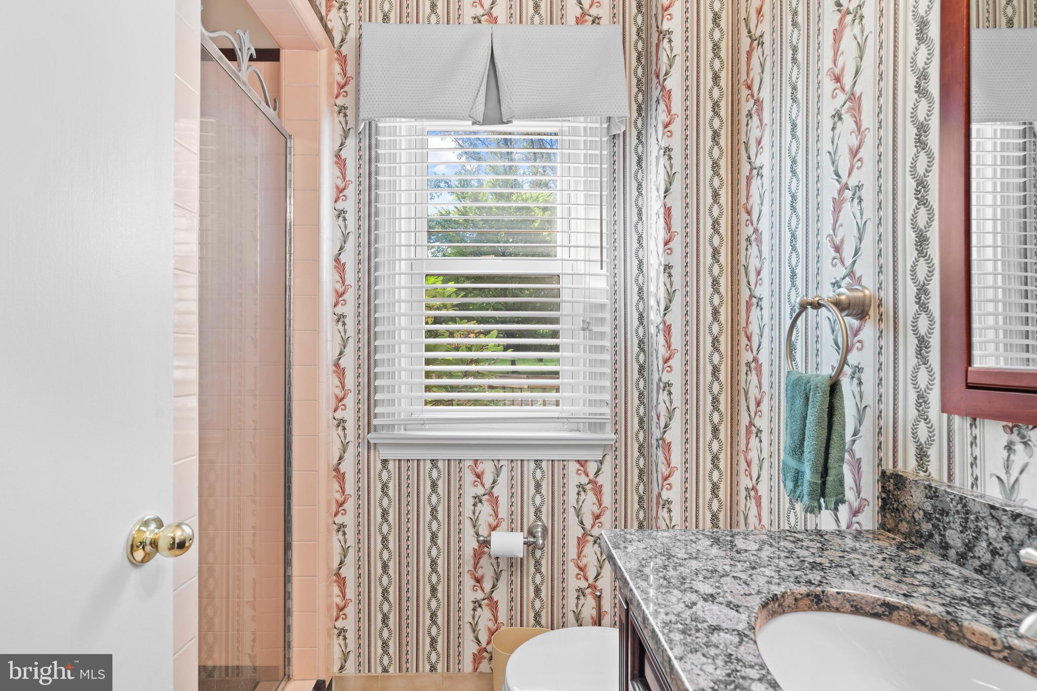 610 Broad Acres Road Penn Valley, PA 19072 - Photo 18 of 41 a bathroom with a granite countertop sink and a mirror