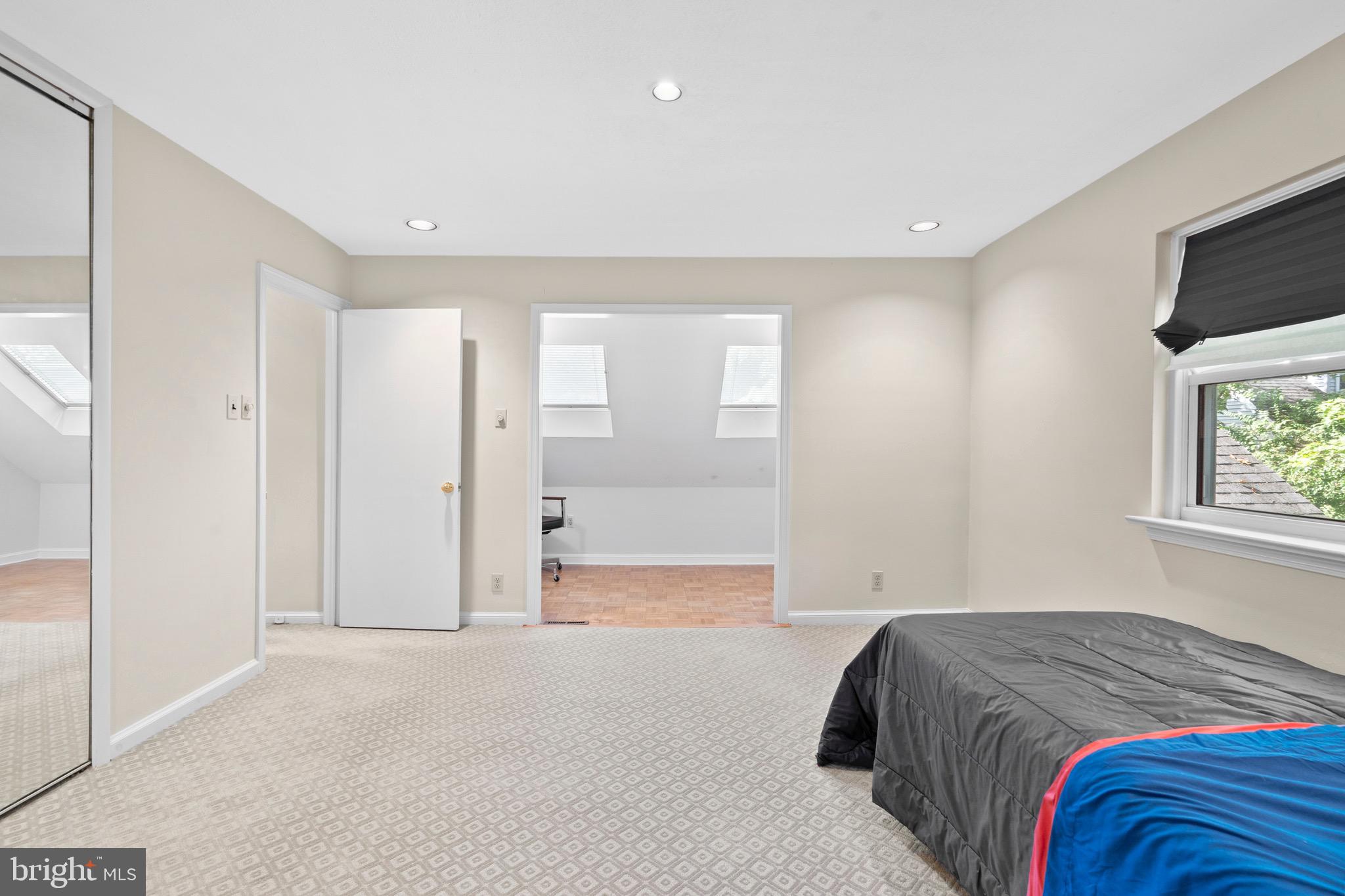 610 Broad Acres Road Penn Valley, PA 19072 - Photo 24 of 41 a bedroom with a bed and a flat screen tv