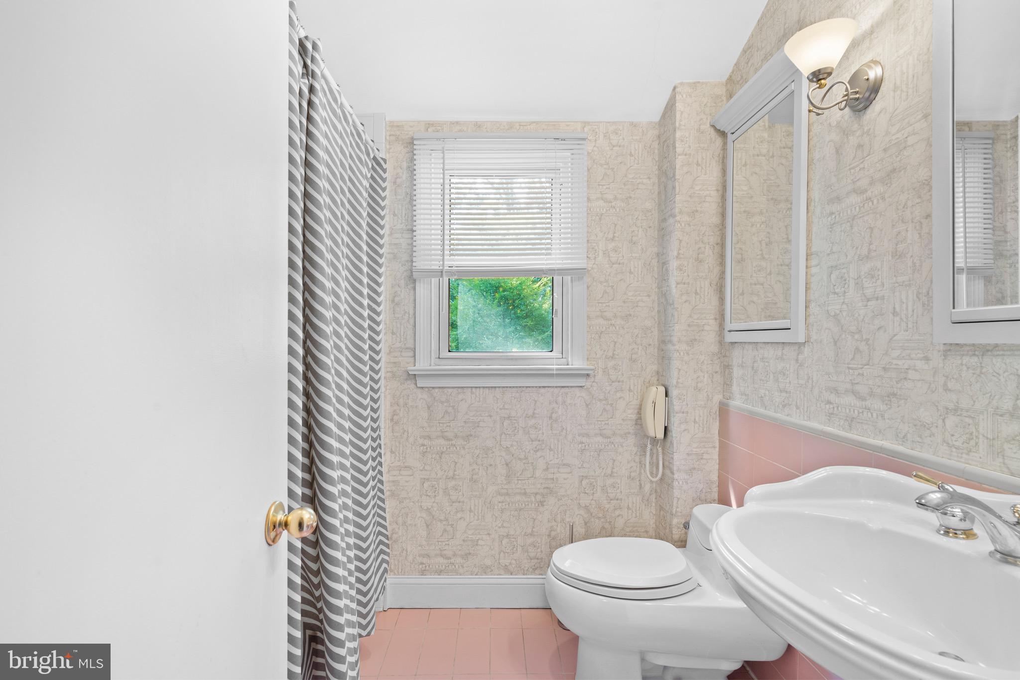 610 Broad Acres Road Penn Valley, PA 19072 - Photo 27 of 41 a white toilet sitting next to a bathroom sink