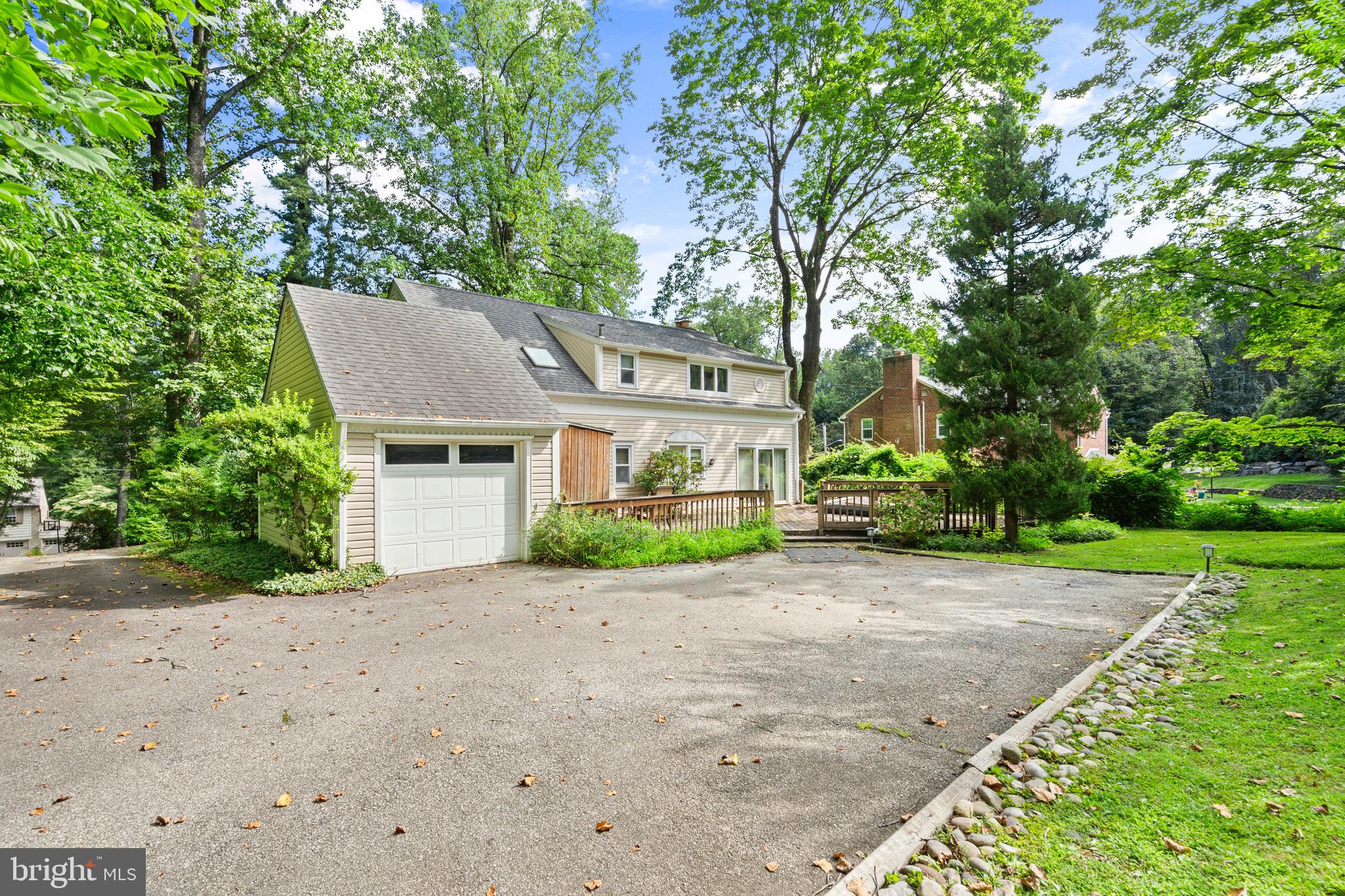 610 Broad Acres Road Penn Valley, PA 19072 - Photo 32 of 41 front view of a house with a yard