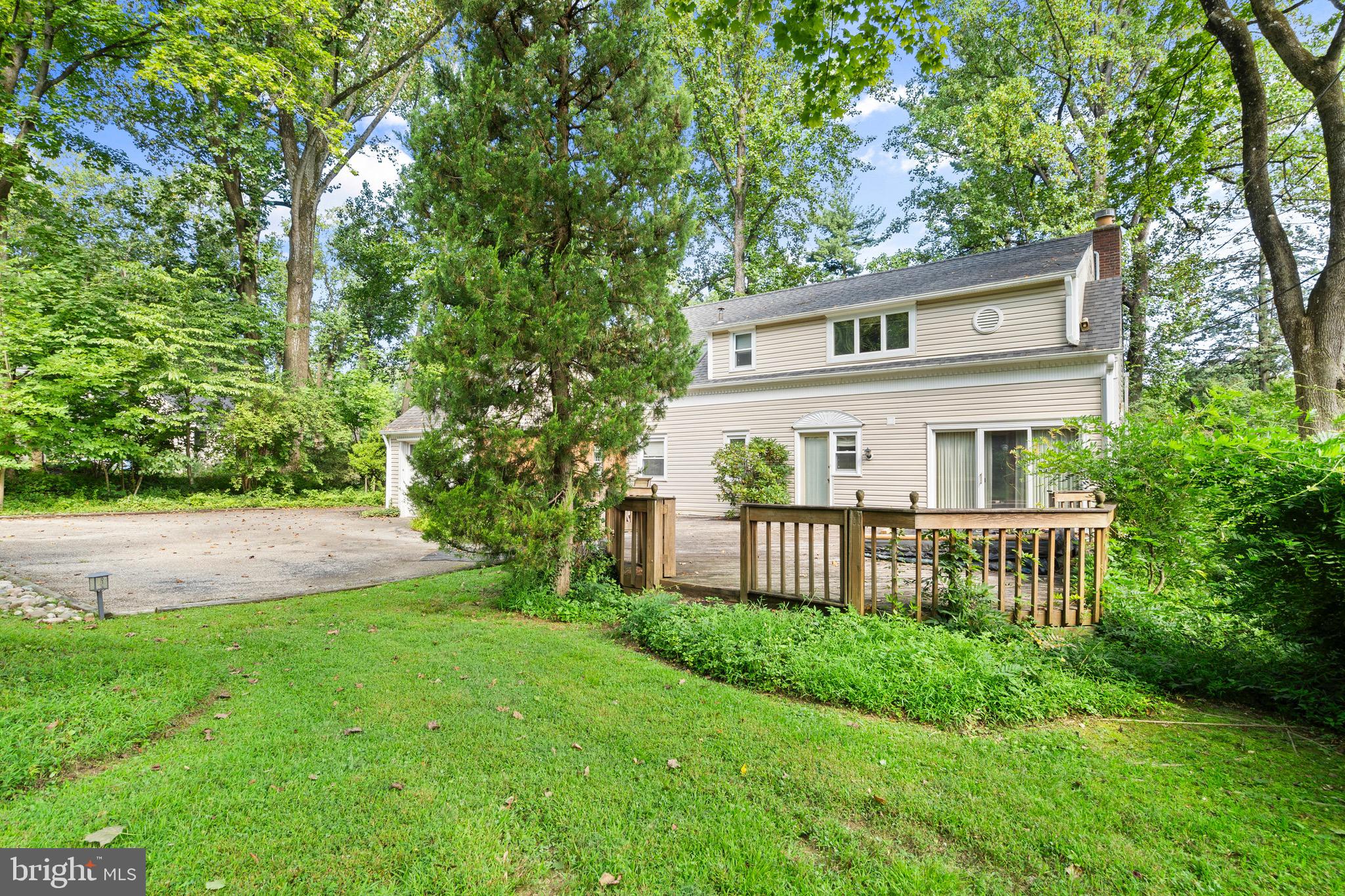 610 Broad Acres Road Penn Valley, PA 19072 - Photo 33 of 41 a front view of a house with garden