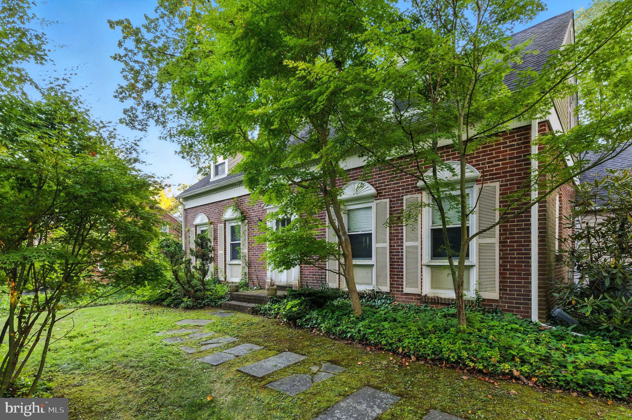 610 Broad Acres Road Penn Valley, PA 19072 - Photo 4 of 41 a front view of a house with garden