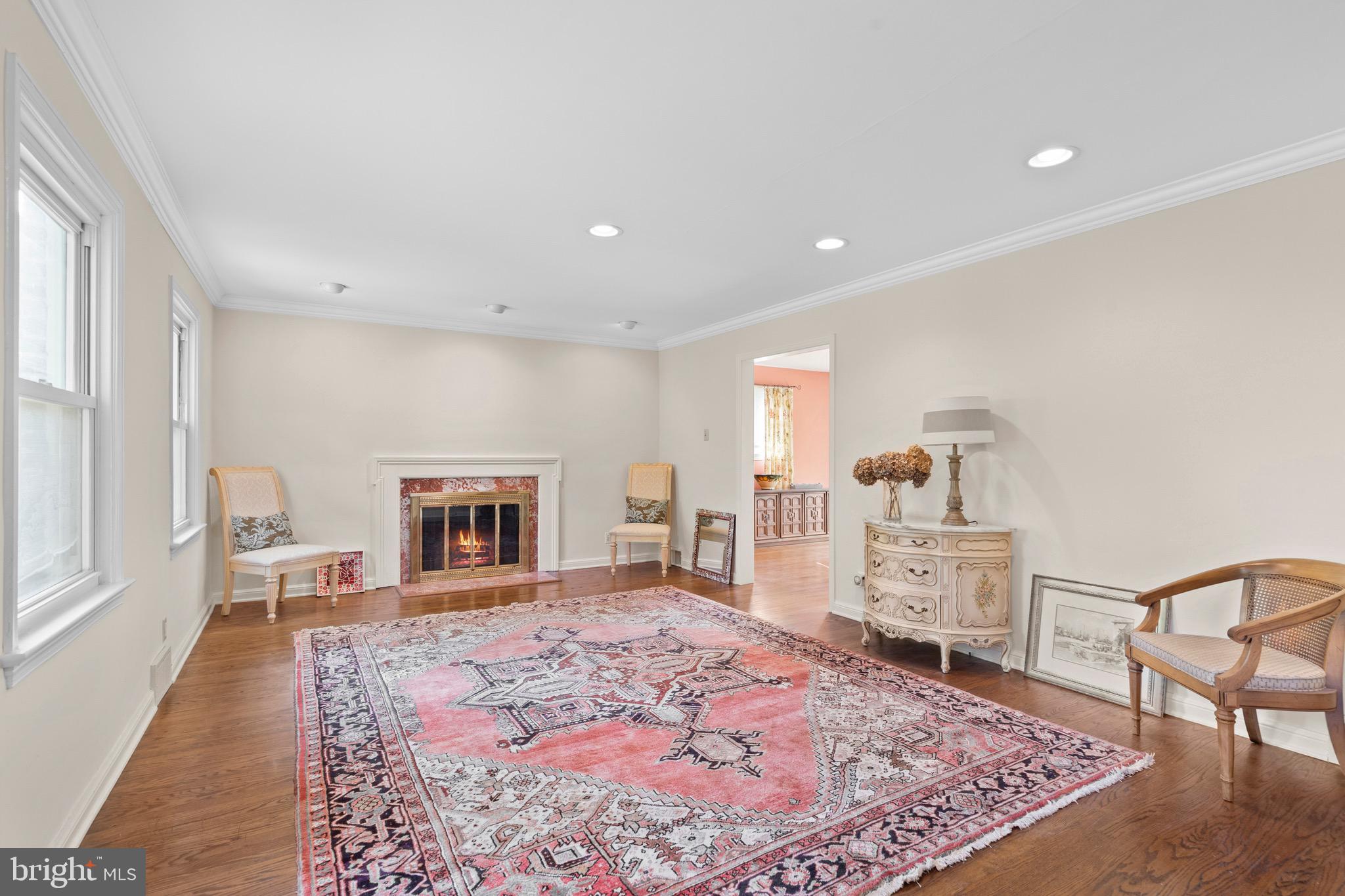 610 Broad Acres Road Penn Valley, PA 19072 - Photo 5 of 41 a living room with furniture a rug and a fireplace