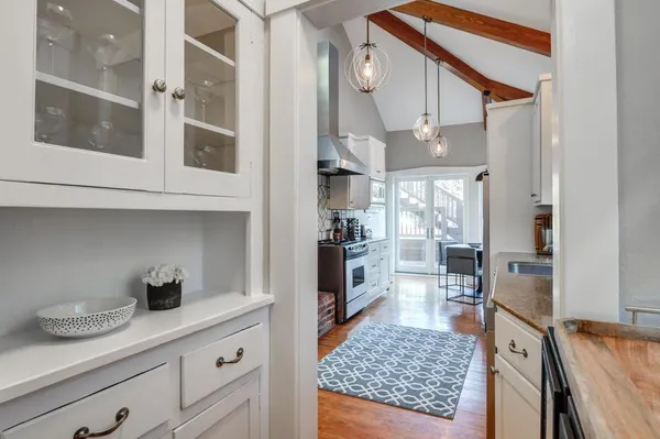 a kitchen with stainless steel appliances granite countertop a sink and cabinets