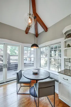 a view of a dining room with furniture window and outside view