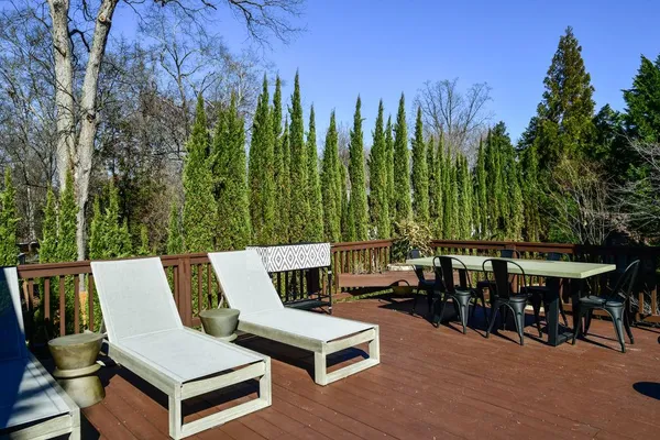 a view of a patio with chairs and table in the patio