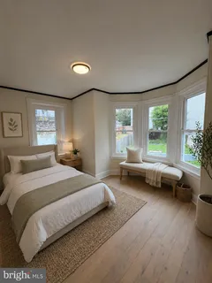 a bedroom with a bed and a couch