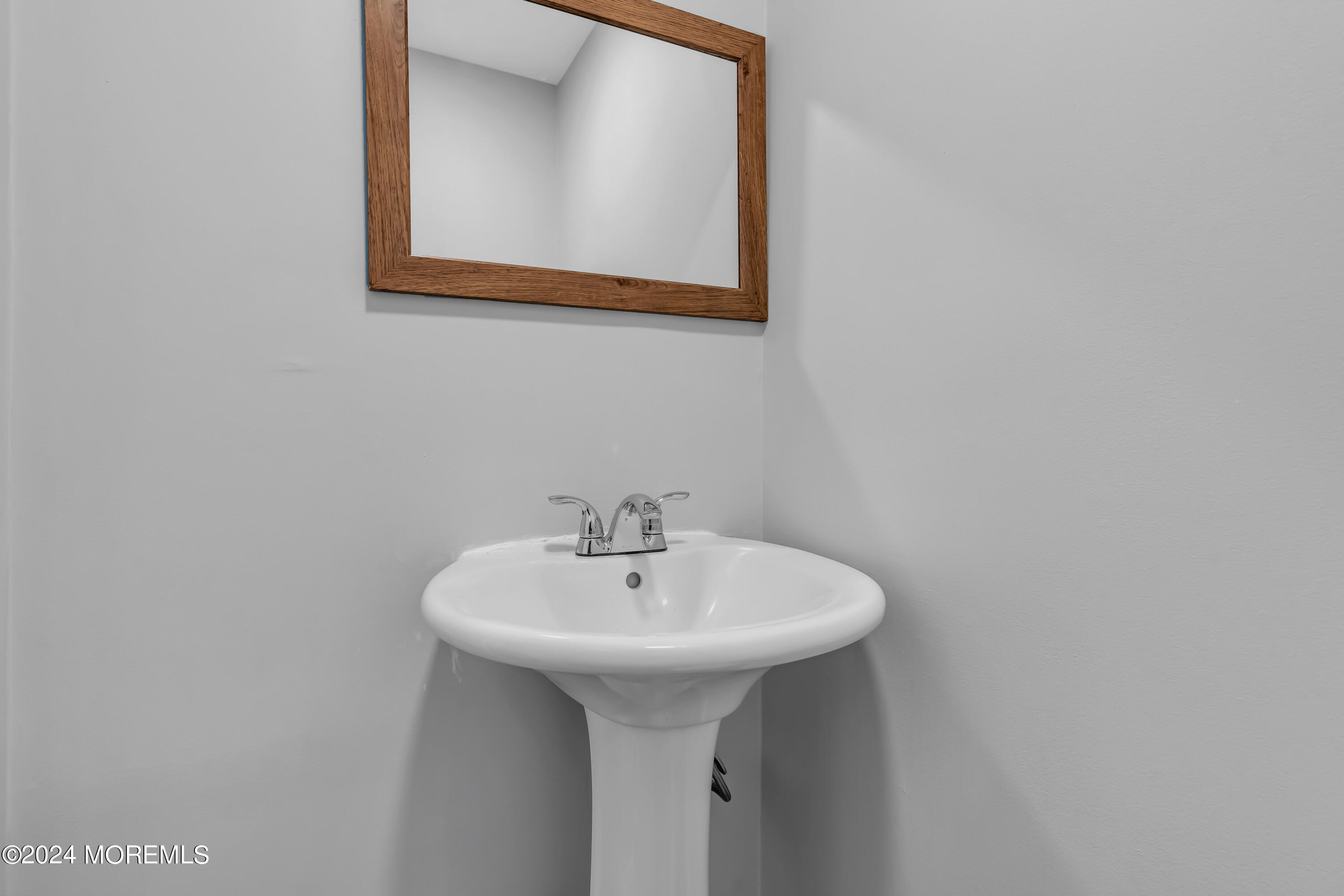 100 1st Street, Unit 8 Keyport, NJ 07735 - Photo 11 of 55 a bathroom with a sink and a mirror