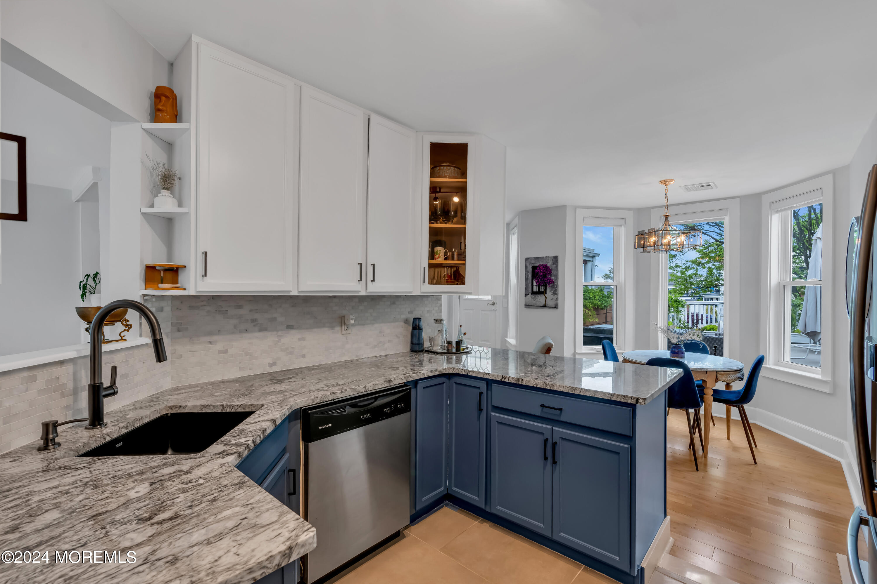 100 1st Street, Unit 8 Keyport, NJ 07735 - Photo 13 of 55 a kitchen with stainless steel appliances granite countertop a sink stove and cabinets