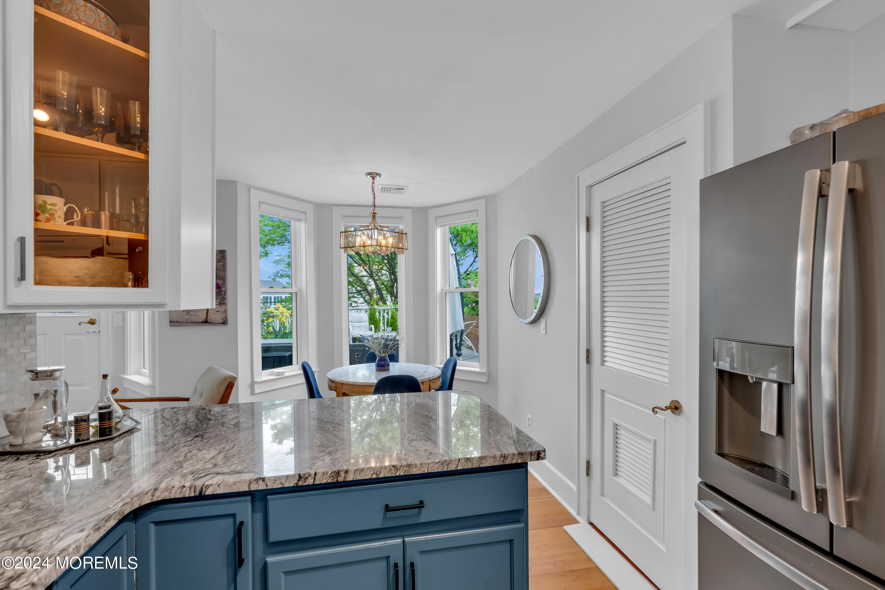 100 1st Street, Unit 8 Keyport, NJ 07735 - Photo 14 of 55 a kitchen with stainless steel appliances granite countertop a sink refrigerator and cabinets