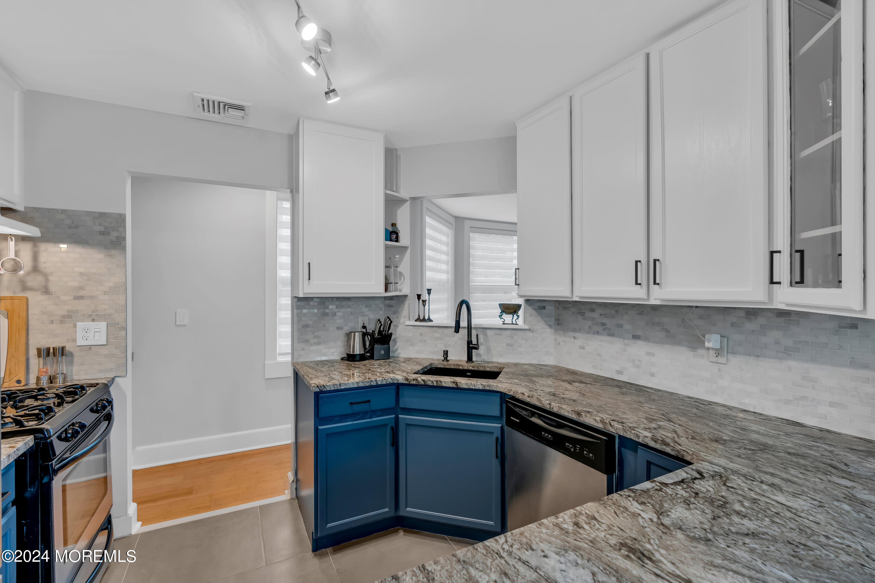 100 1st Street, Unit 8 Keyport, NJ 07735 - Photo 15 of 55 a kitchen with stainless steel appliances granite countertop a sink stove and refrigerator