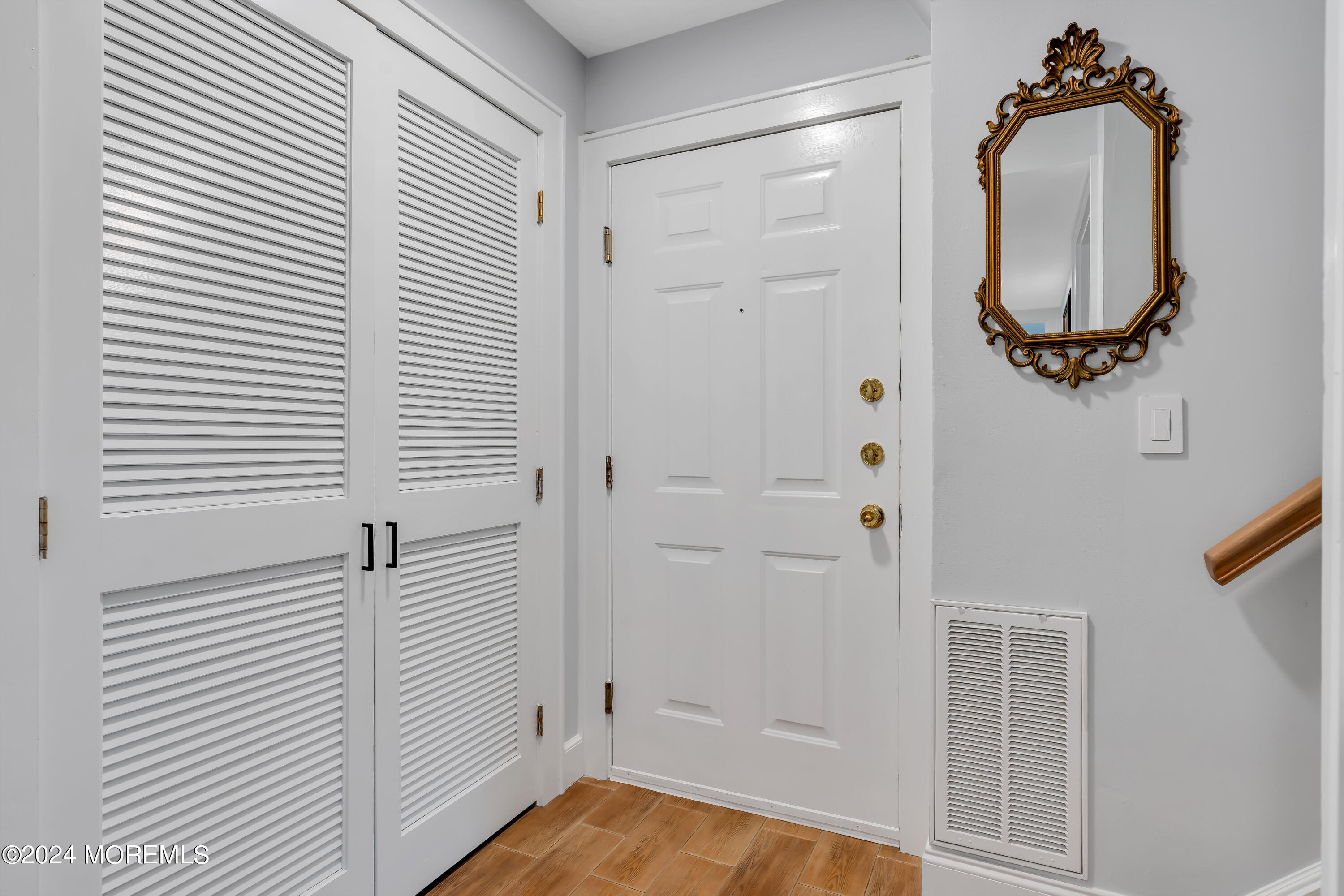 100 1st Street, Unit 8 Keyport, NJ 07735 - Photo 2 of 55 a view of a livingroom with bathroom and a mirror
