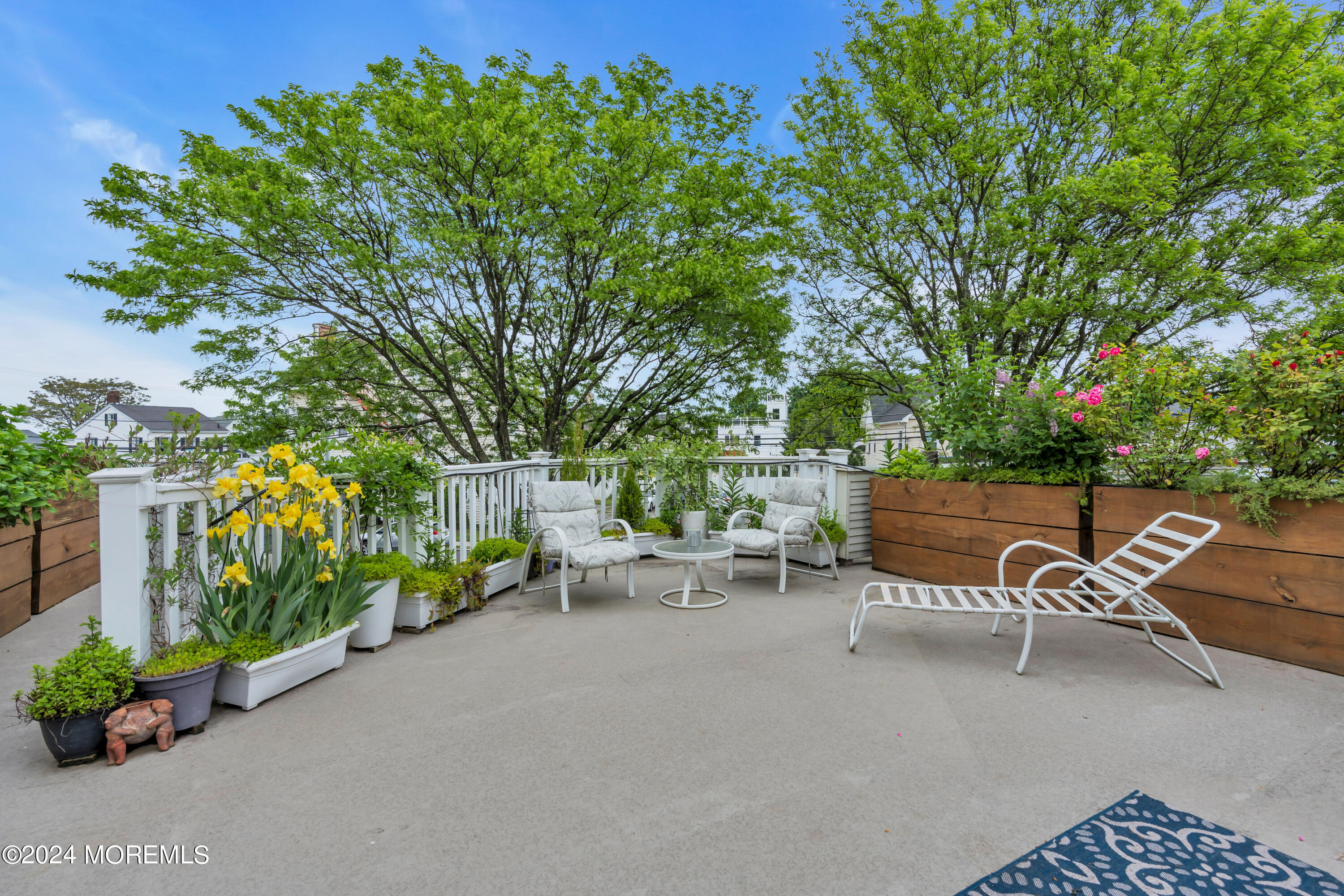 100 1st Street, Unit 8 Keyport, NJ 07735 - Photo 26 of 55 a backyard of a house with table and chairs