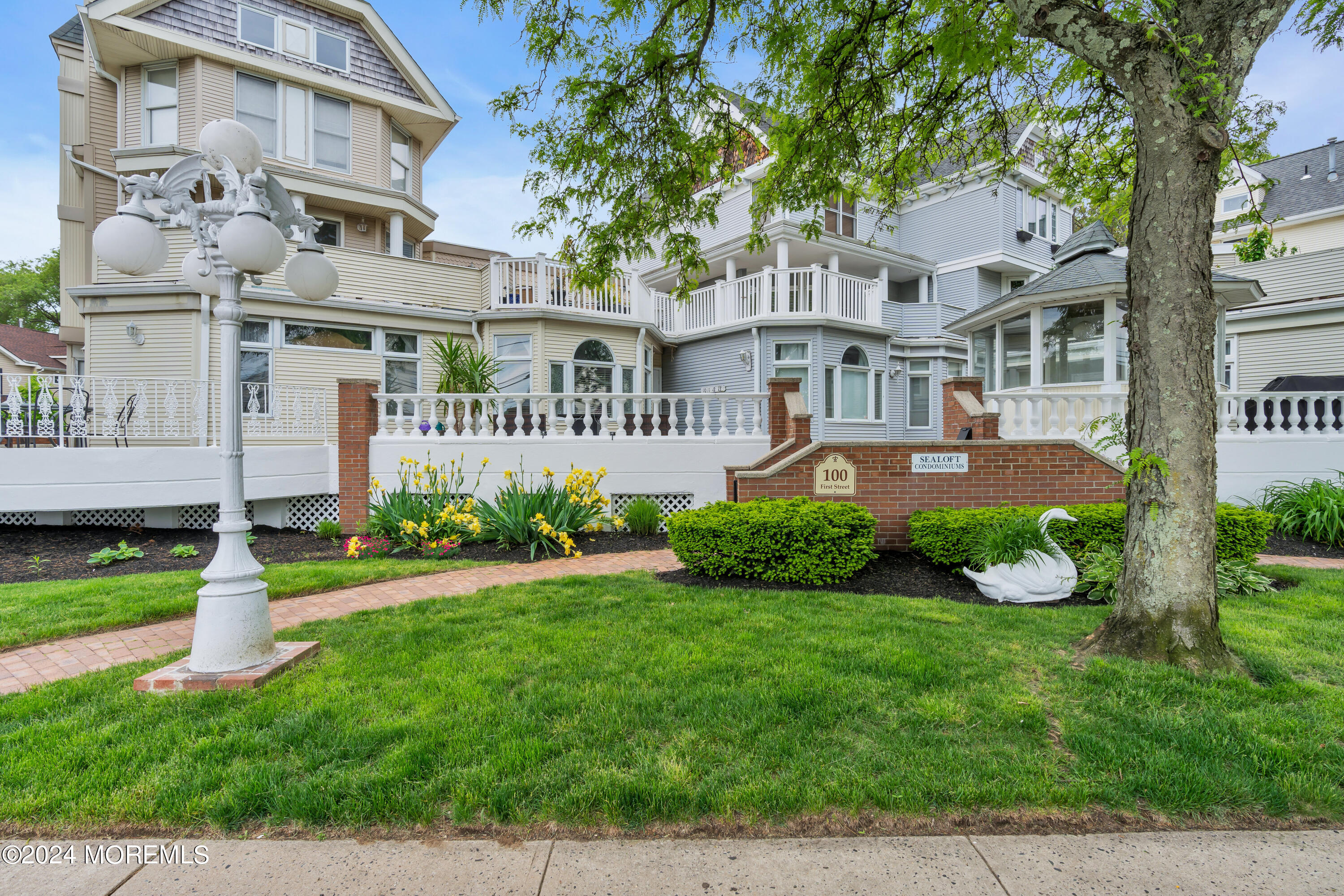 100 1st Street, Unit 8 Keyport, NJ 07735 - Photo 55 of 55 a front view of a residential apartment building with a yard