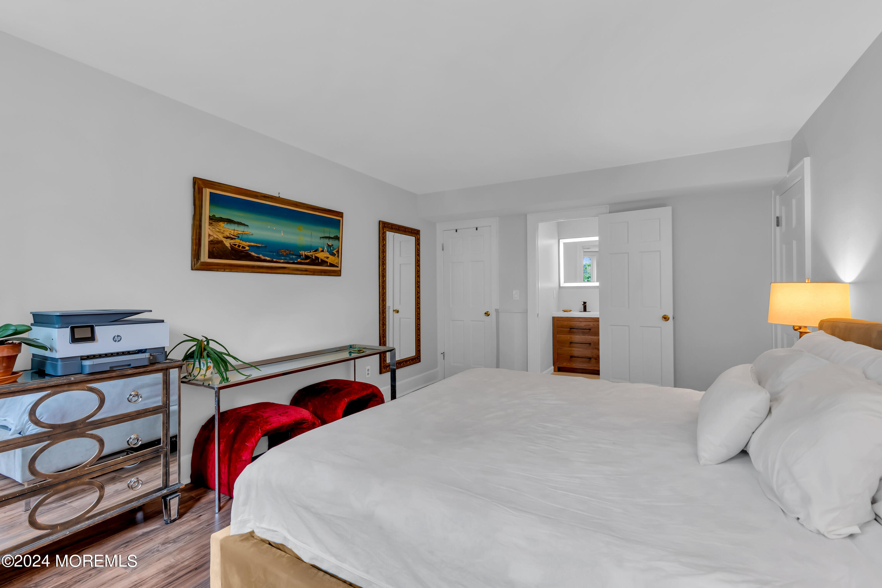 100 1st Street, Unit 8 Keyport, NJ 07735 - Photo 9 of 55 a bedroom with a bed and a lamp on dresser