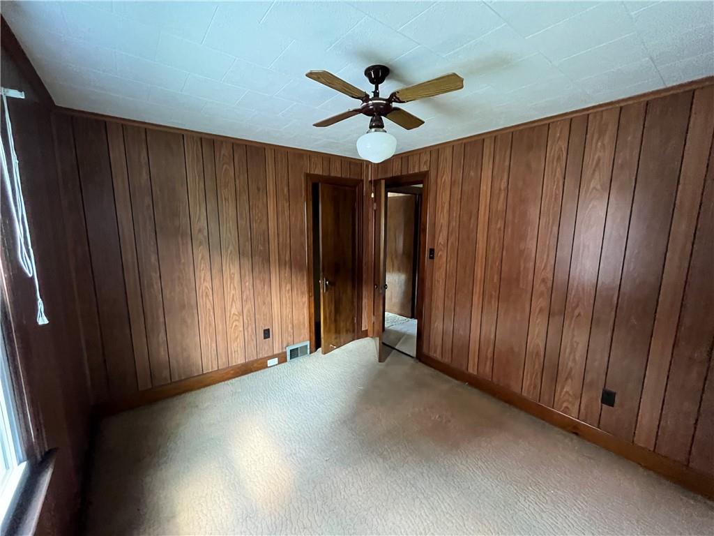 708 Nichols Street Clearfield, PA 16830 - Photo 12 of 12 a view of a livingroom with a ceiling fan and hardwood floor